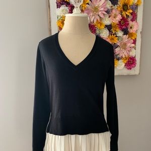 Sweater with flutter bottom